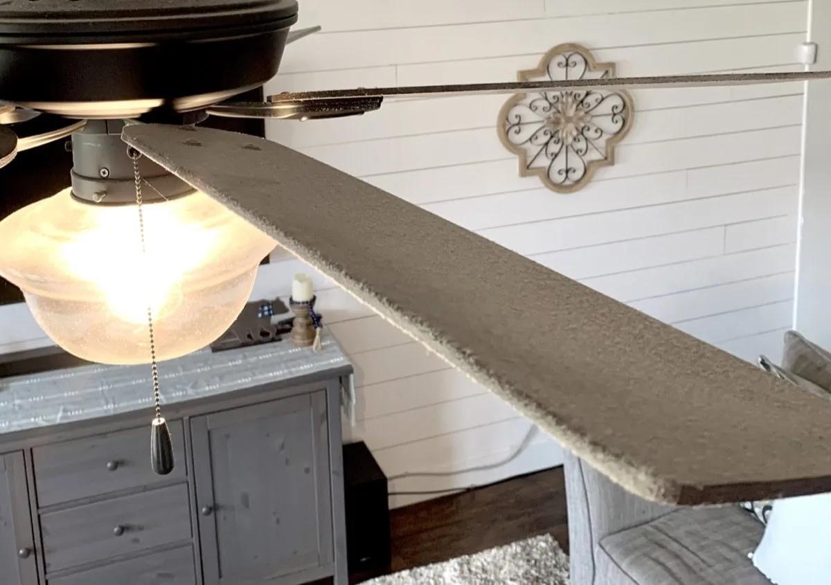Dusty ceiling fan in family room.
