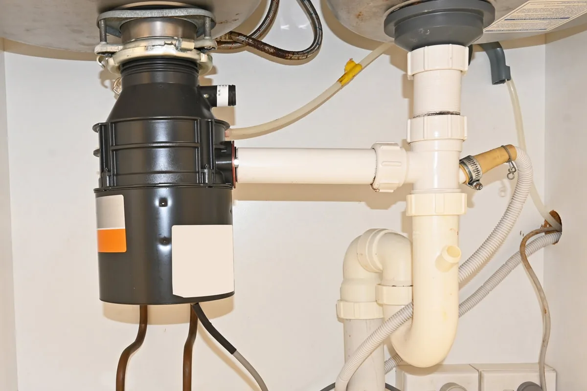 Garbage disposal installed under a kitchen sink