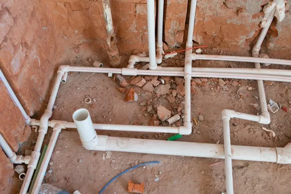 plumber installing new piping to replace home plumbing