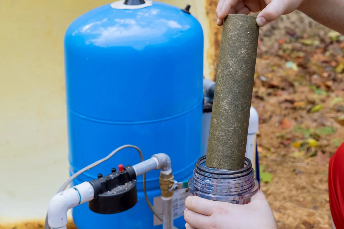Sediment water filtration and softener system with cartridge housings on a home water line.
