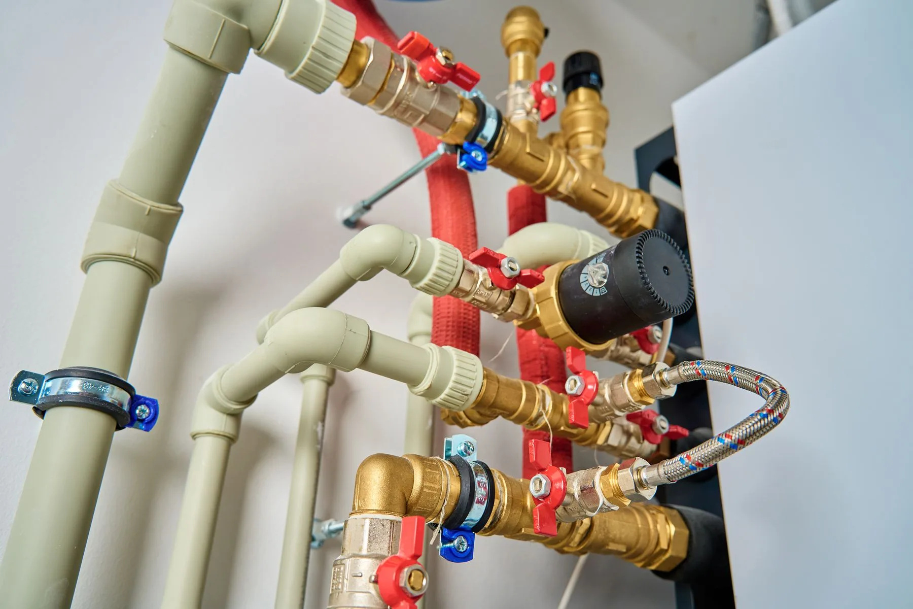 Pipes and shutoff valves connected to a boiler system