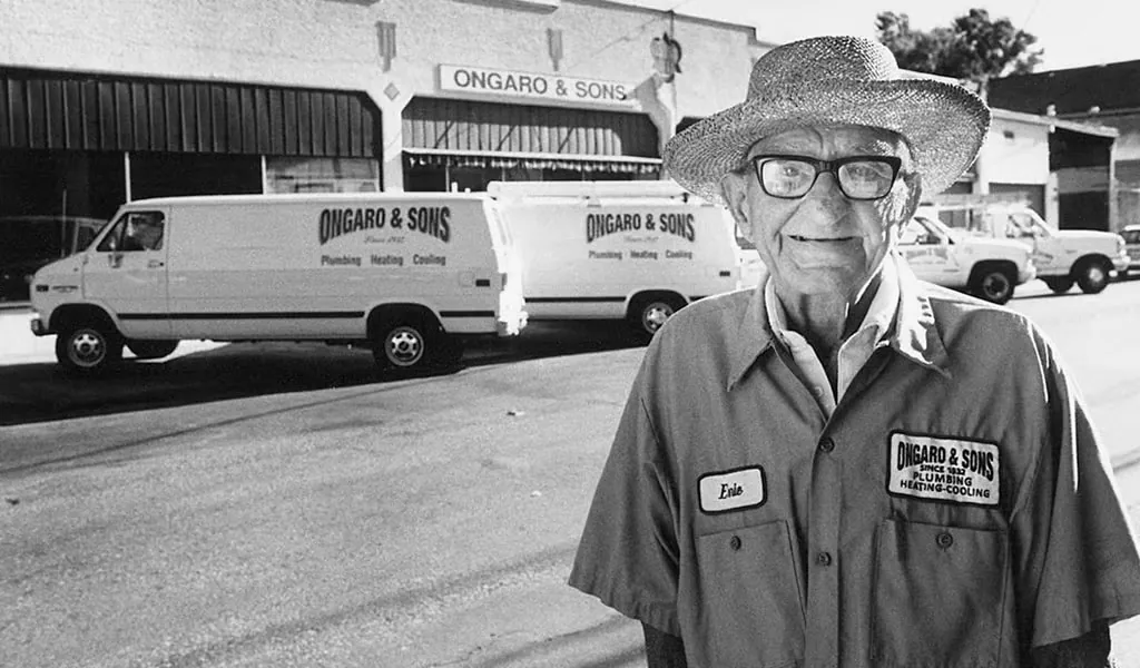 Ongaro & Sons founder with the company's early service trucks
