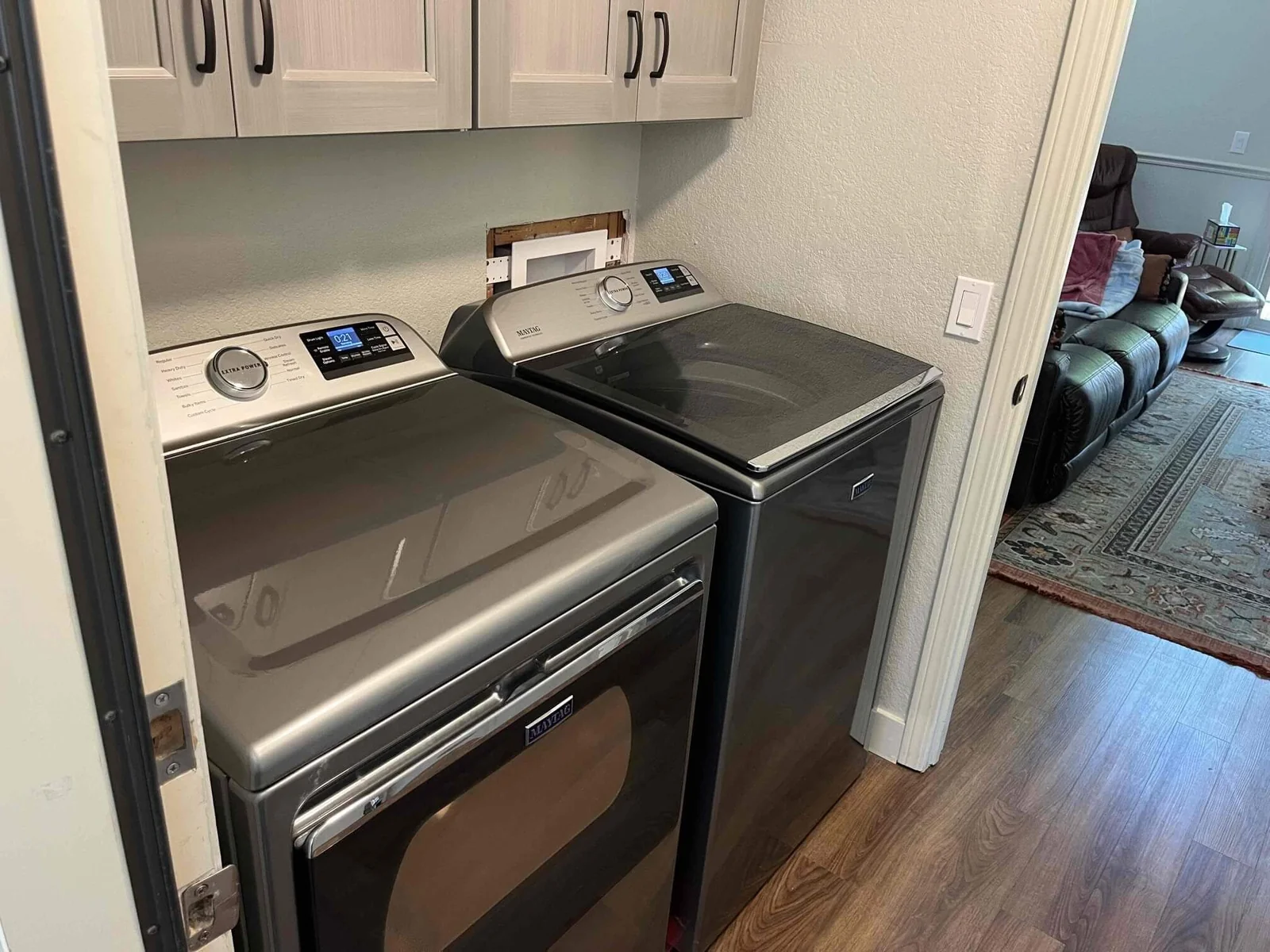 A finished laundry hookup with new valves and drain connection