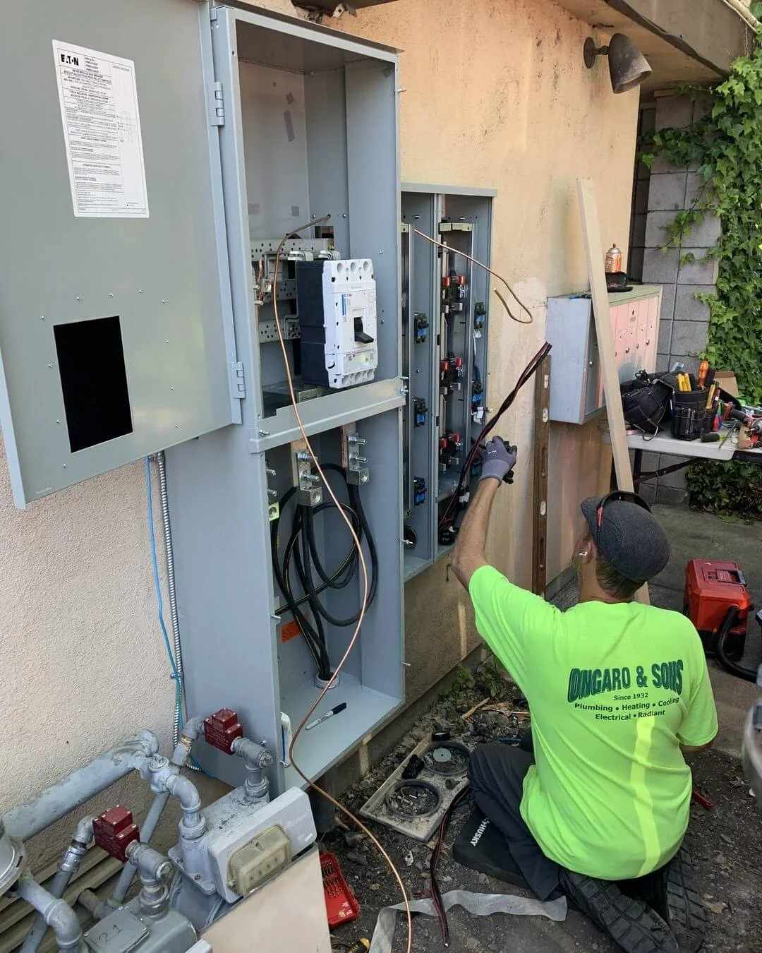 An Ongaro & Sons electrician wiring a main disconnect