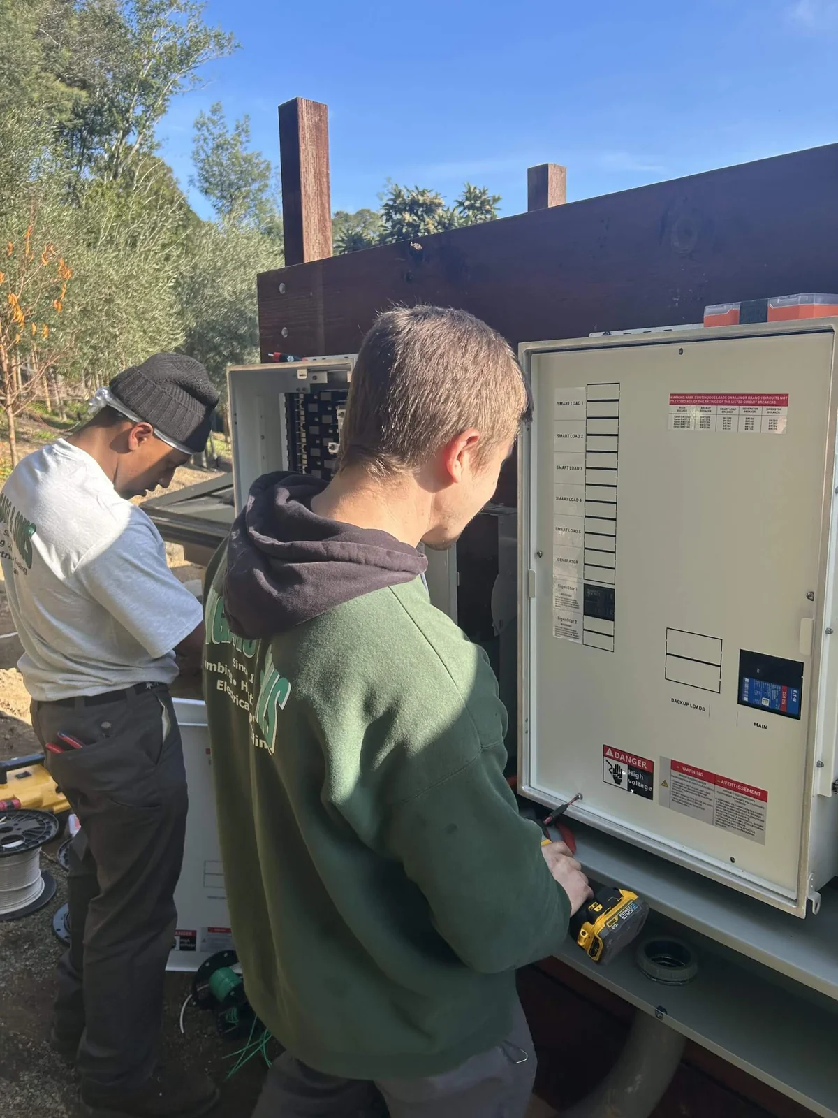 Ongaro & Sons electricians installing a subpanel