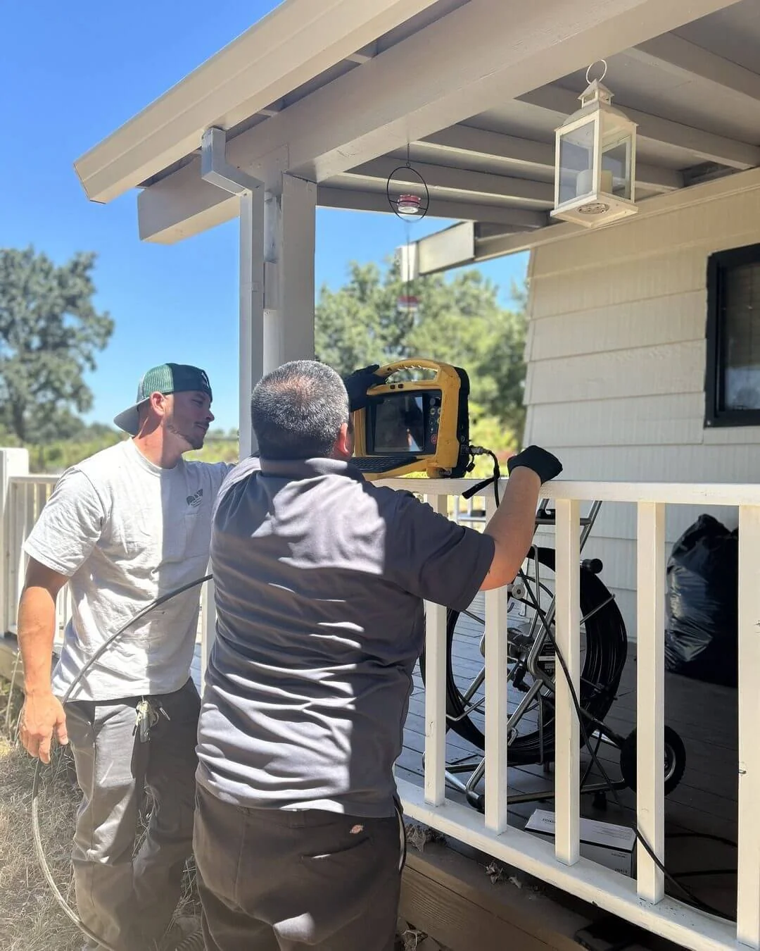 An Ongaro & Sons plumber running a sewer camera inspection