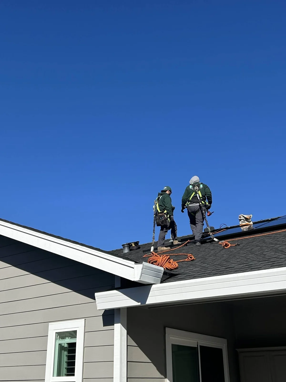 Ongaro & Sons installers working in fall protection on a rooftop solar array