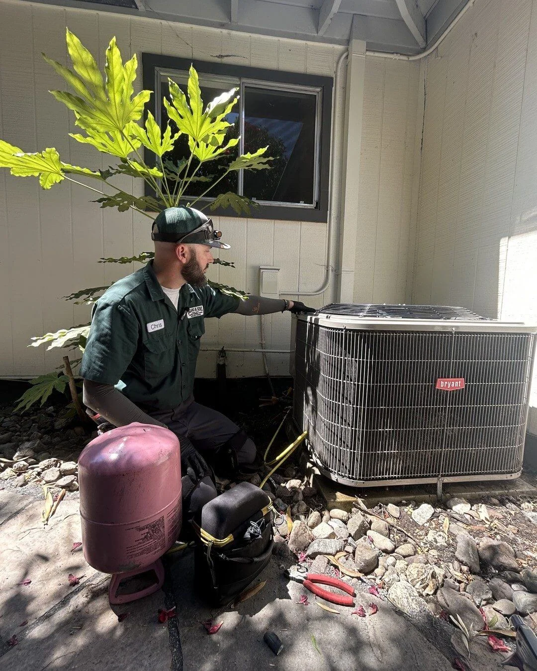 An Ongaro & Sons technician recovering refrigerant at a condenser