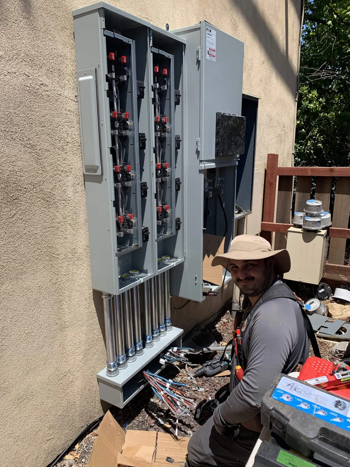 An Ongaro & Sons electrician at exterior service disconnects