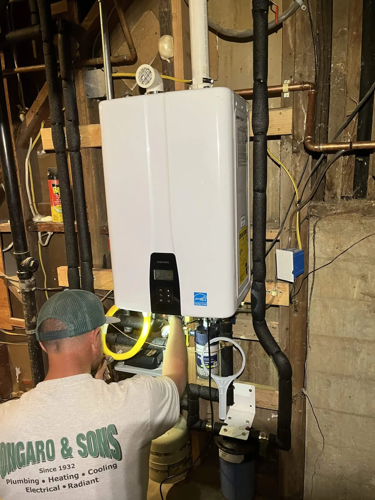 A tankless water heater installed in a crawlspace