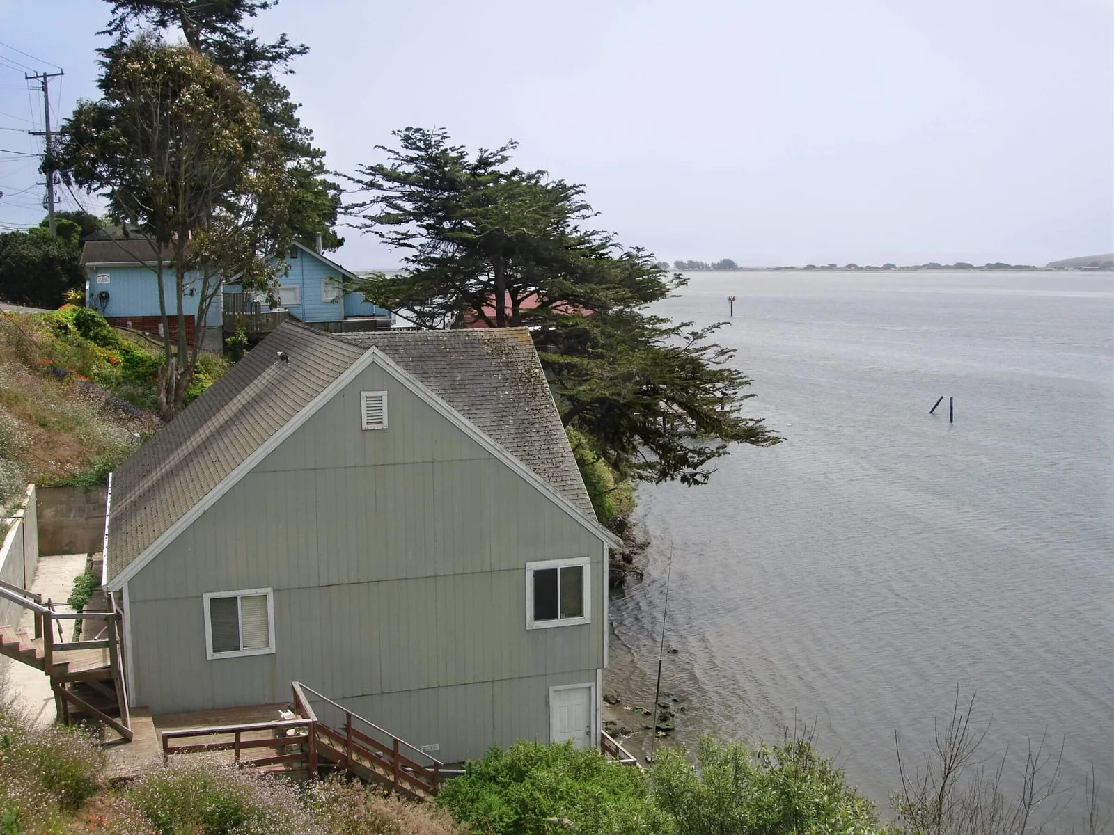 A house standing at the water's edge in Bodega Bay