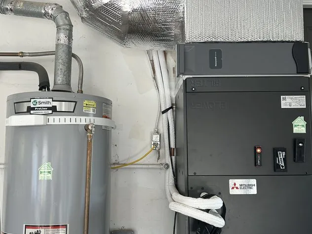 Mitsubishi air handler installed in a residential mechanical room