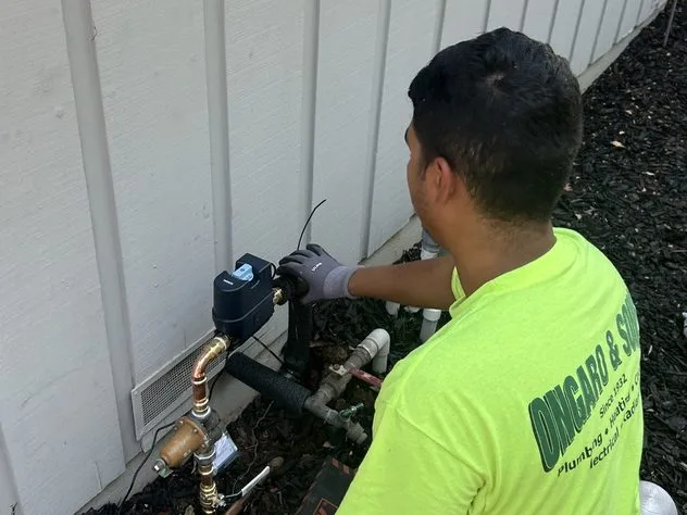 Ongaro & Sons technician installing a water treatment bypass valve