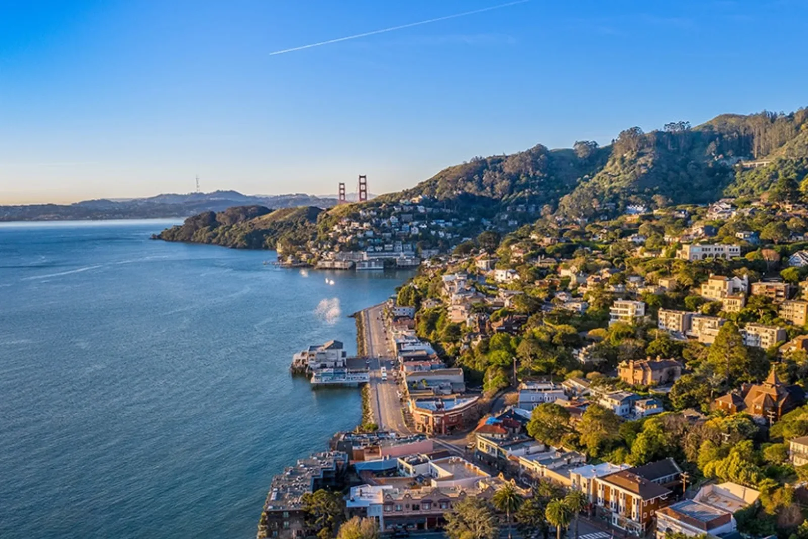 Aerial view of a Marin County waterfront community along San Francisco Bay at golden hour.