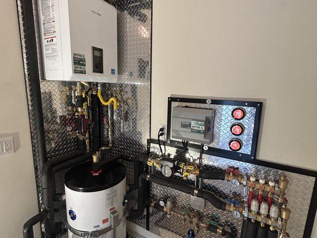 Radiant heating manifold installed by Ongaro & Sons